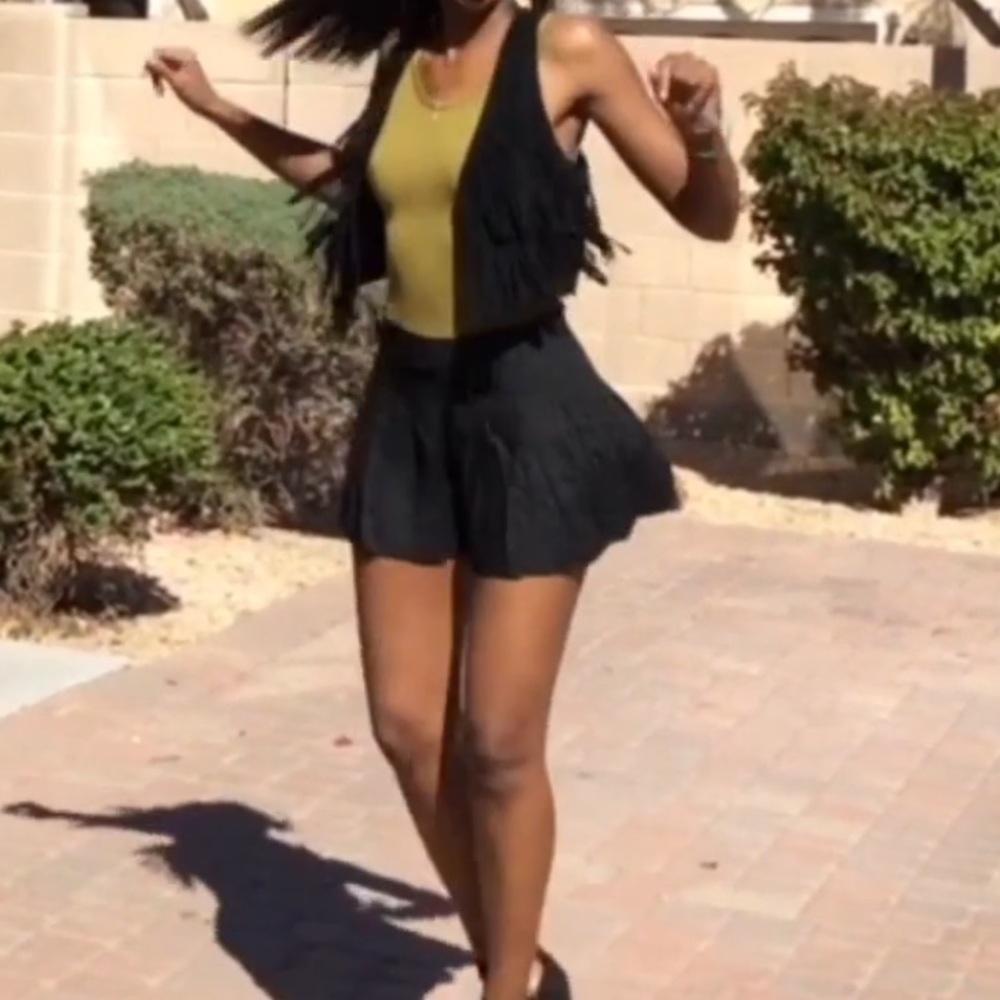 Black pleated shorts.